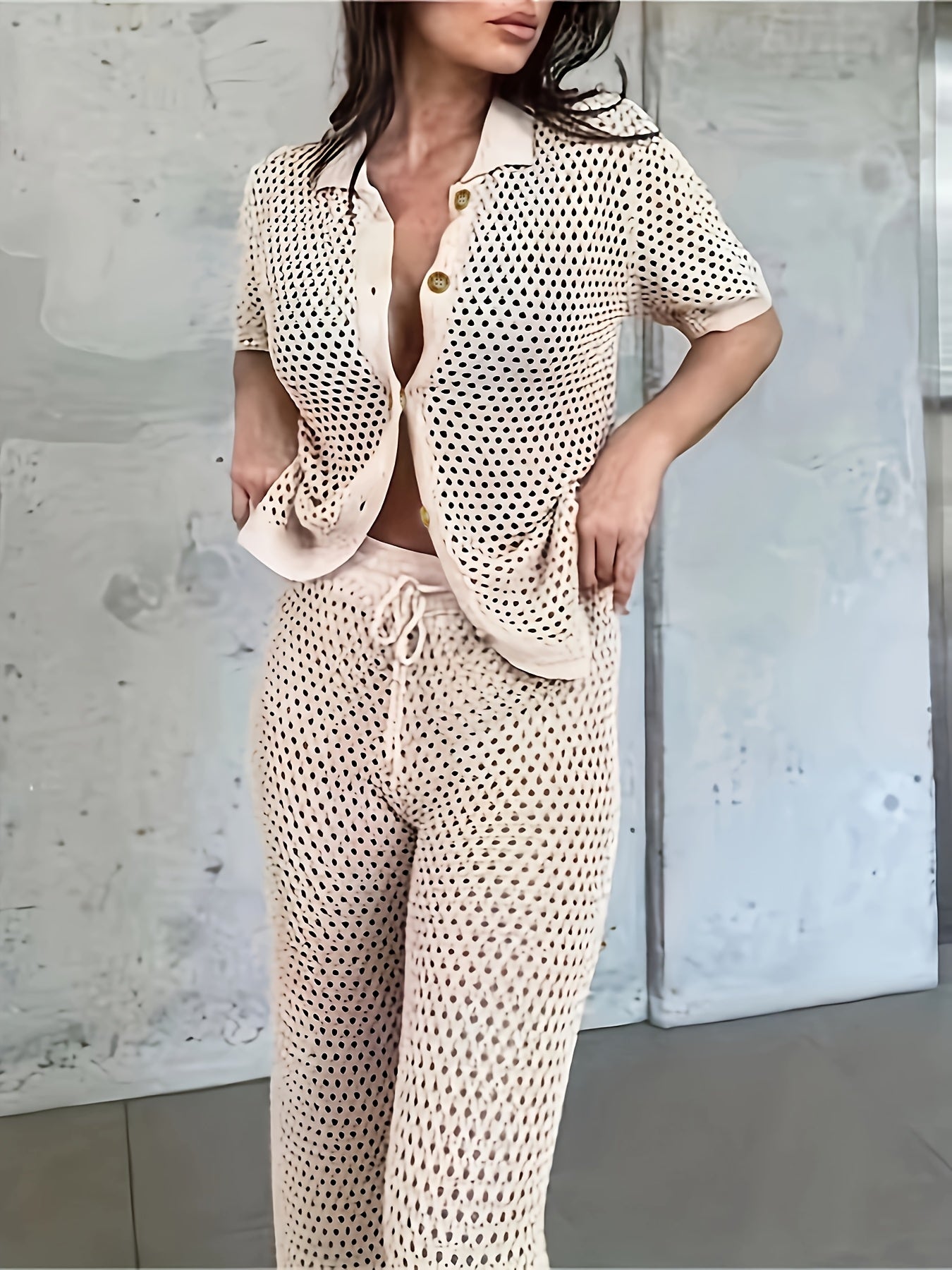 A Solid Color Knitted Two-Piece Set, Featuring a Casual Short-Sleeve Cardigan And Loose-Fitting Pants, Designed for Women.