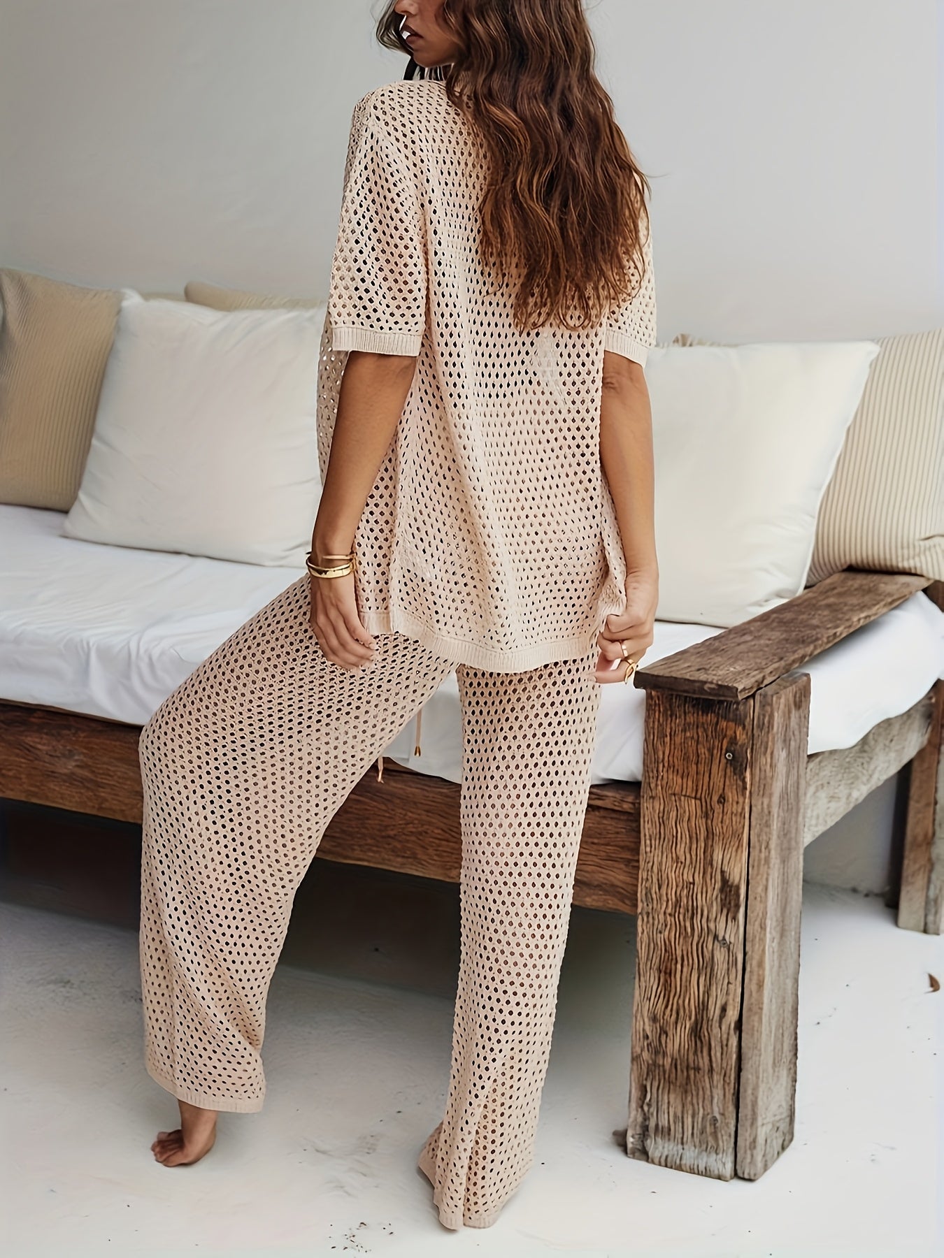 A Solid Color Knitted Two-Piece Set, Featuring a Casual Short-Sleeve Cardigan And Loose-Fitting Pants, Designed for Women.